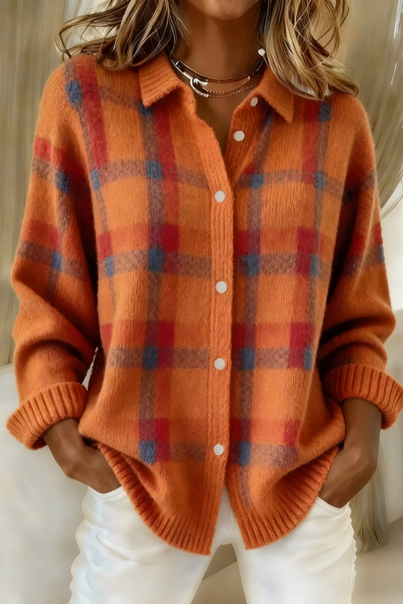 Orange plaid knit cardigan with button-front, V-neck collar, long sleeves.