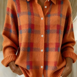 Orange plaid knit cardigan with button-front, V-neck collar, long sleeves.