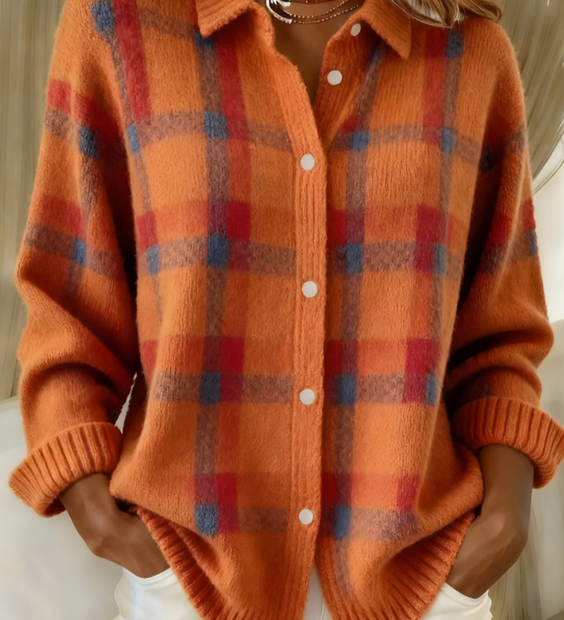 Orange plaid knit cardigan with button-front, V-neck collar, long sleeves.