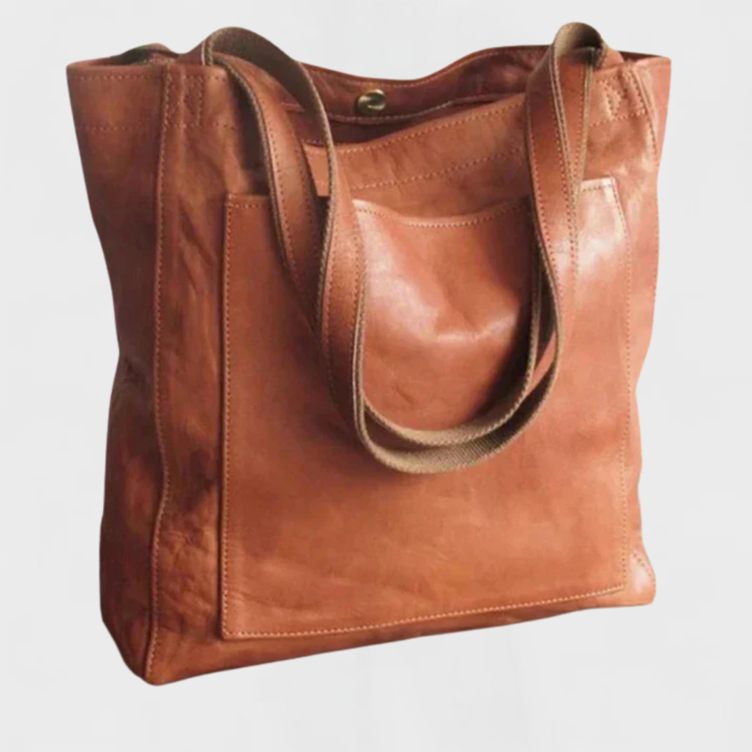 Brown leather tote bag with double top handles and front stitched panel.