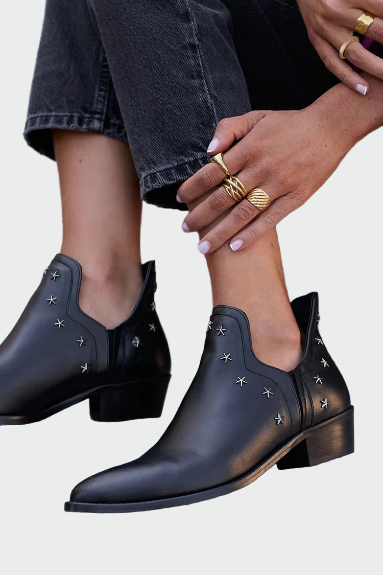 Black leather ankle boots with star details and low block heel
