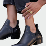 Black leather ankle boots with star details and low block heel