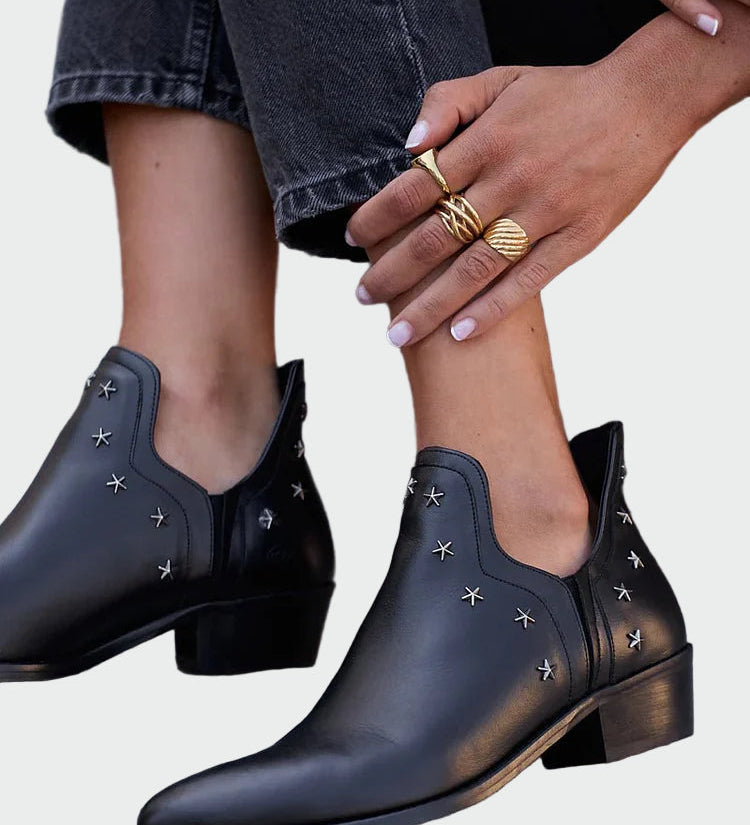 Black leather ankle boots with star details and low block heel