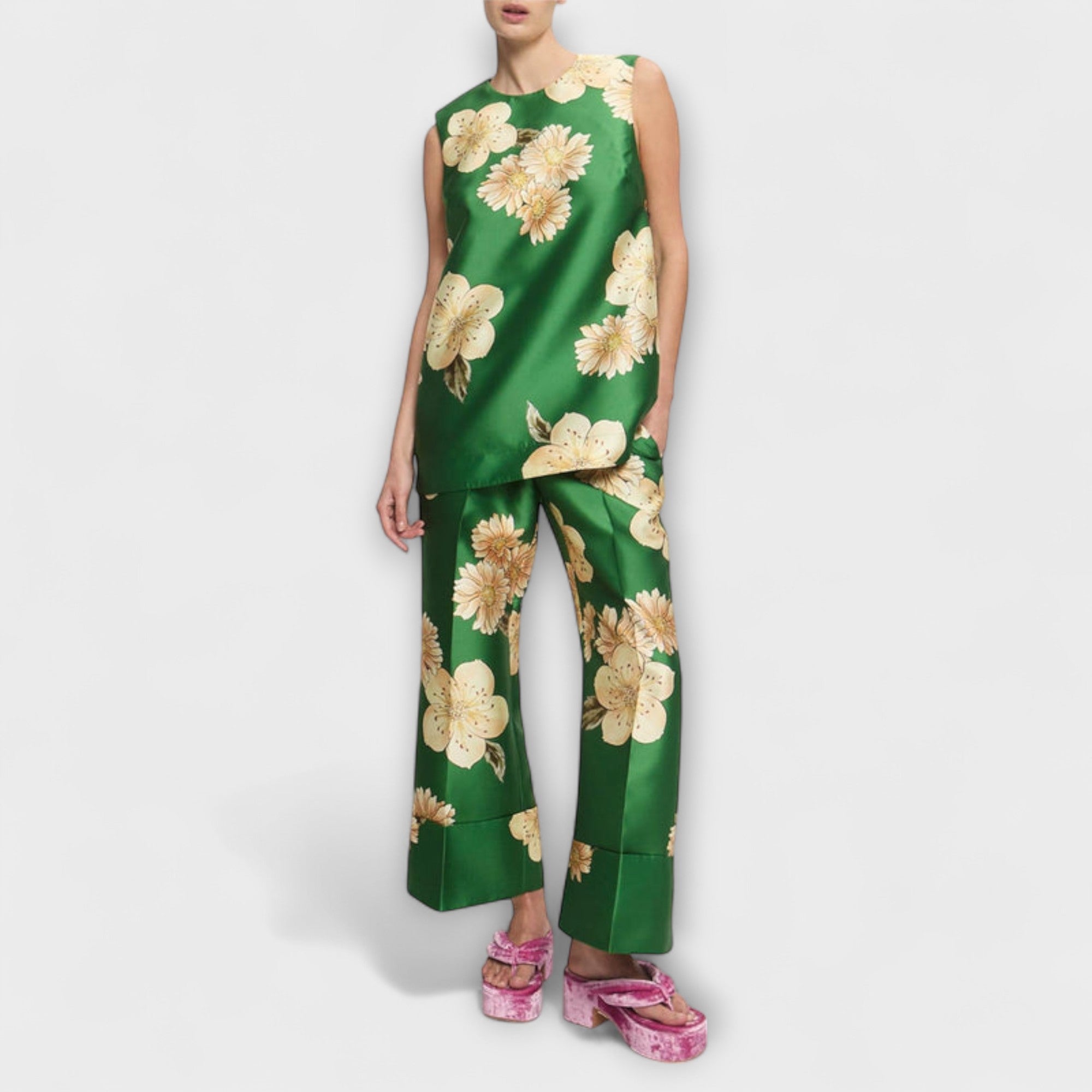 Sage green sleeveless jumpsuit with wide legs, beige floral print