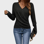 Black structured V-neck pullover sweater with long sleeves and textured knit.