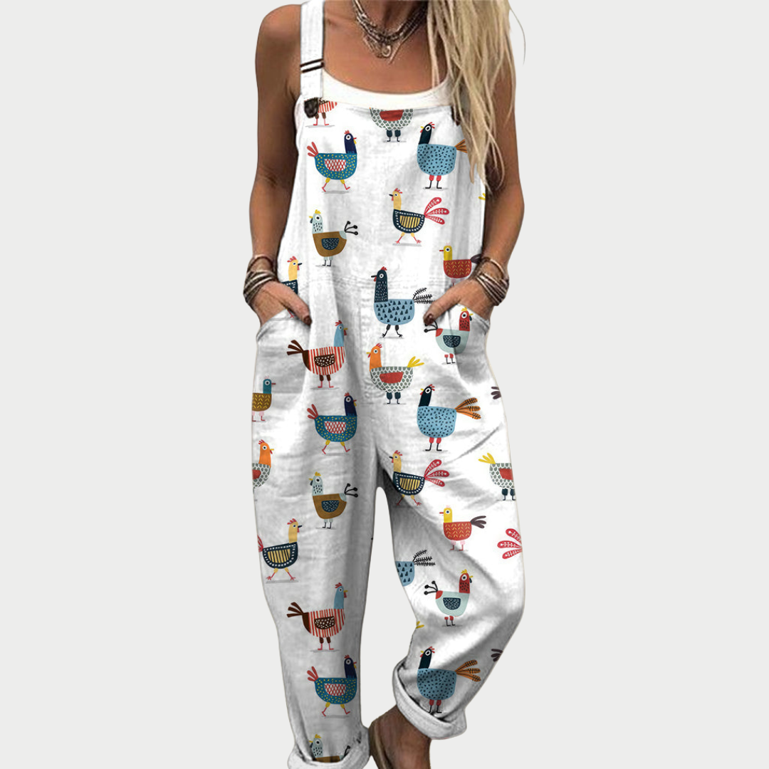 Loose-fit white overalls with colorful animal print, wide straps and bib front
