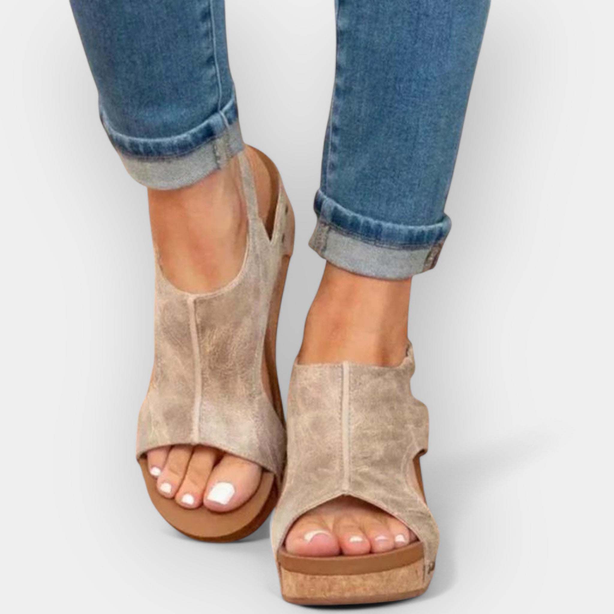 Beige suede platform wedge sandals with open toe and ankle cutout