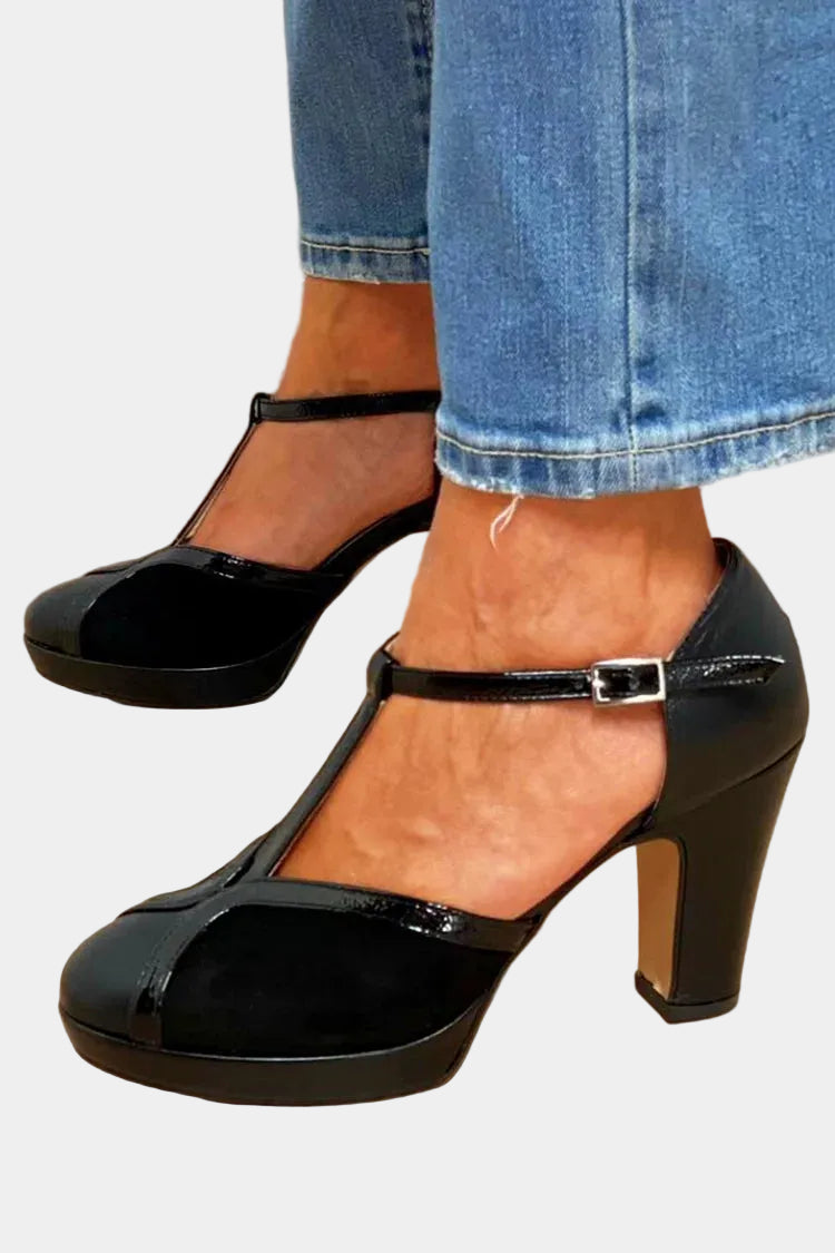 Black T-strap high heels with chunky platform sole and silver buckle closure