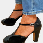 Black T-strap high heels with chunky platform sole and silver buckle closure