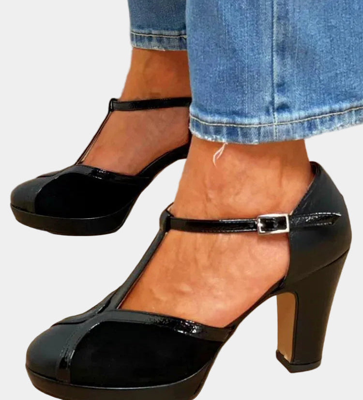Black T-strap high heels with chunky platform sole and silver buckle closure
