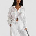 White linen-look button-up shirt and wide-leg pants set, loose fit
