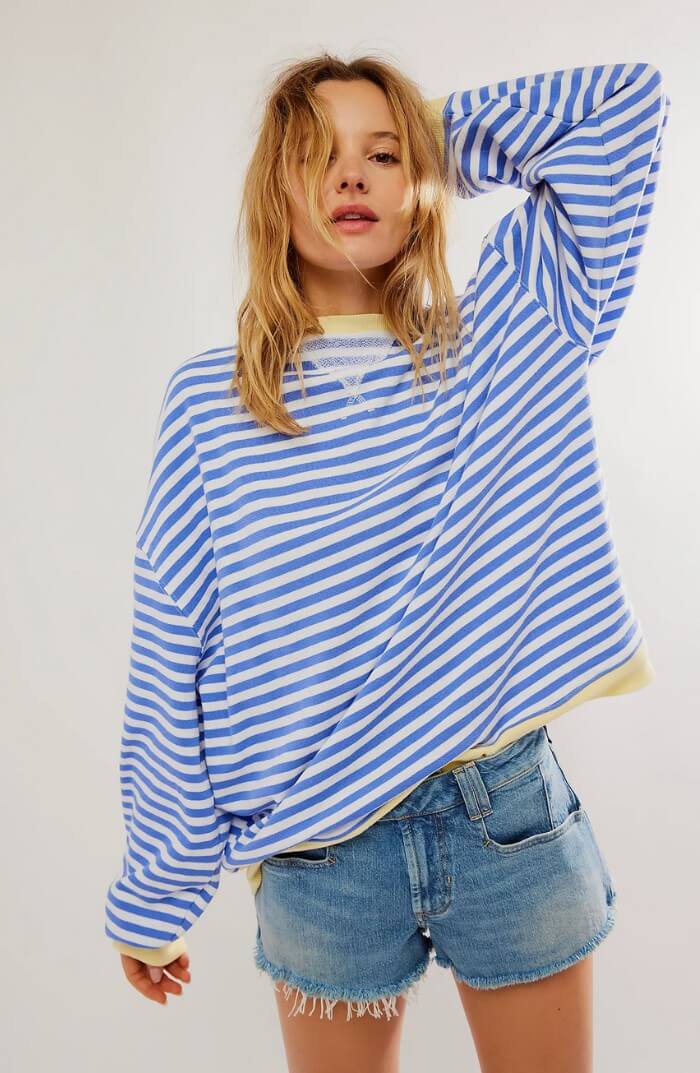 Light blue and white striped relaxed pullover with long sleeves, crew neck