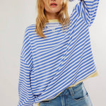 Light blue and white striped relaxed pullover with long sleeves, crew neck