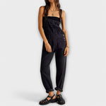 Black denim loose-fit overalls with square bib and front patch pockets