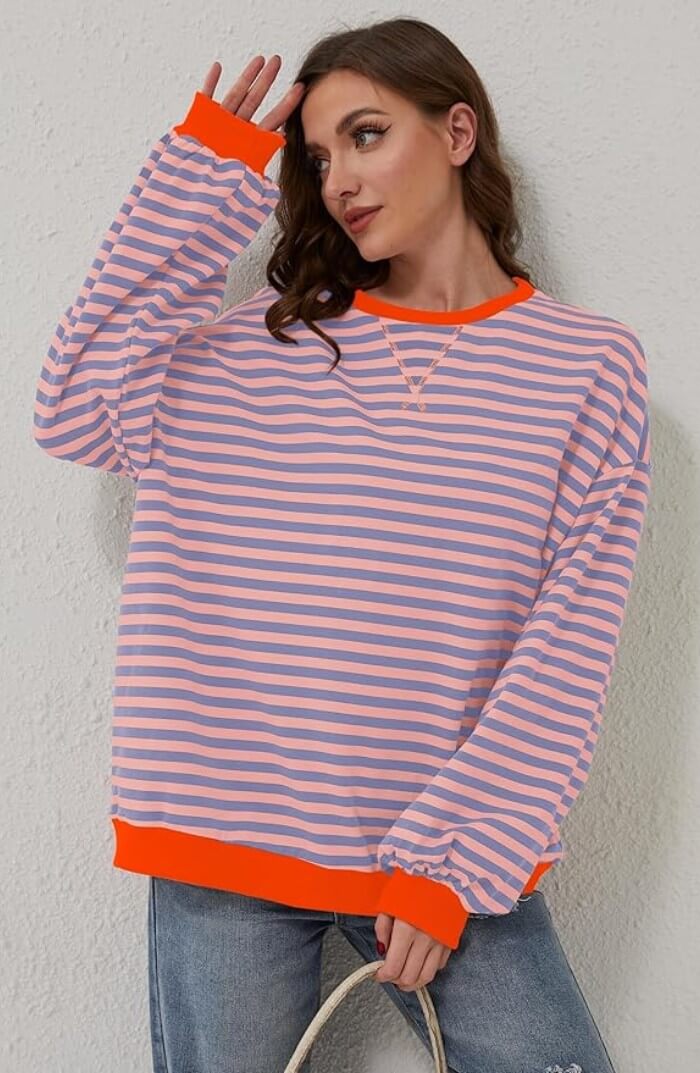 Peach and light blue striped relaxed pullover with orange trim, long sleeves