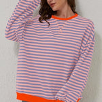 Peach and light blue striped relaxed pullover with orange trim, long sleeves