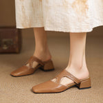 Tan natural leather mule flats with low block heel and ankle cutout strap detail
