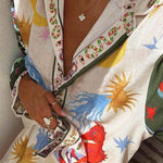 Two-piece set close-up: multicolor trim V-neck button placket on printed shirt