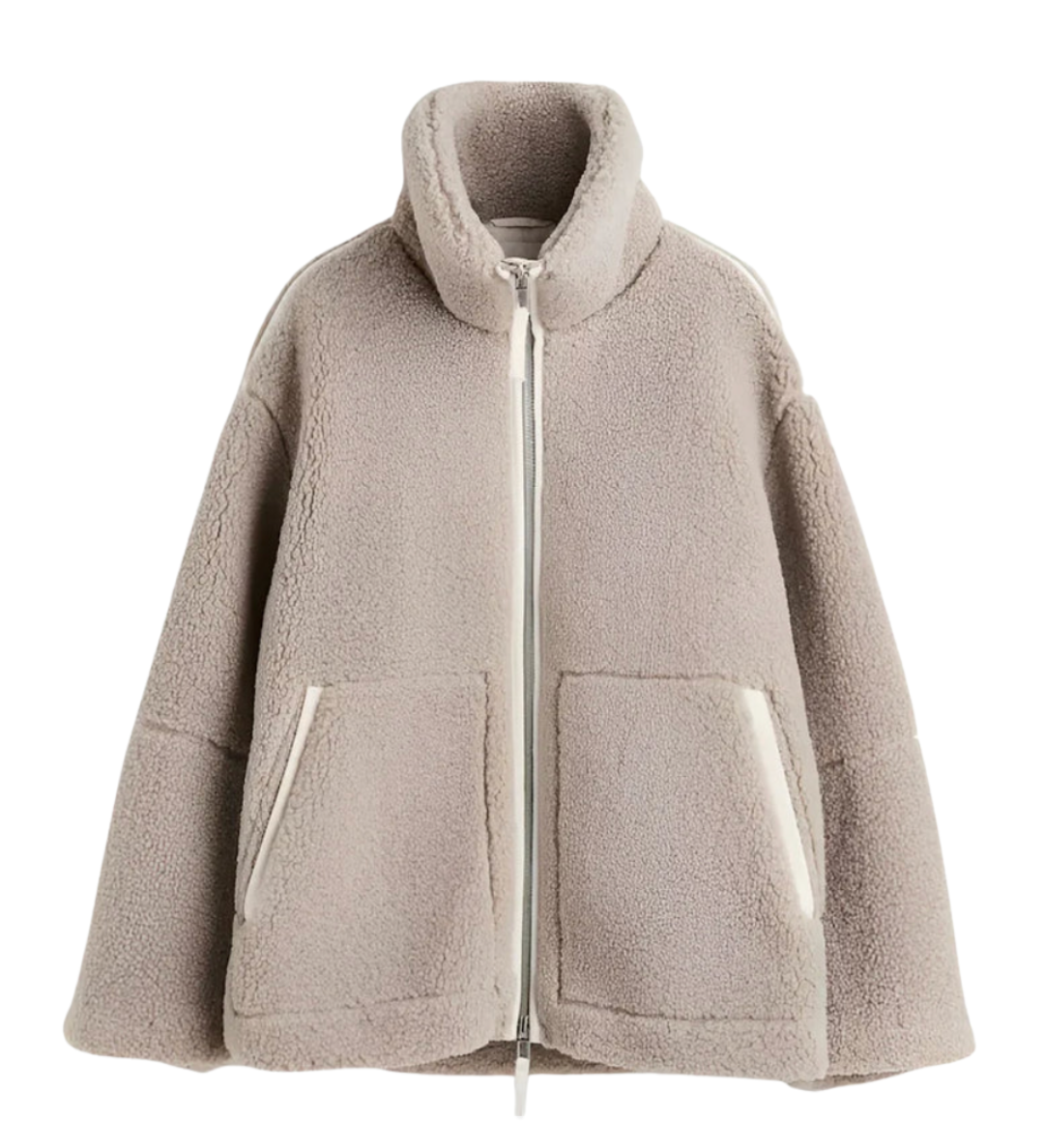 Light taupe sherpa zip-up winter jacket with high collar and two front flap pockets
