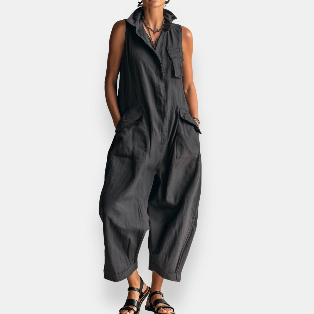 Black sleeveless jumpsuit with button front and large cargo pockets
