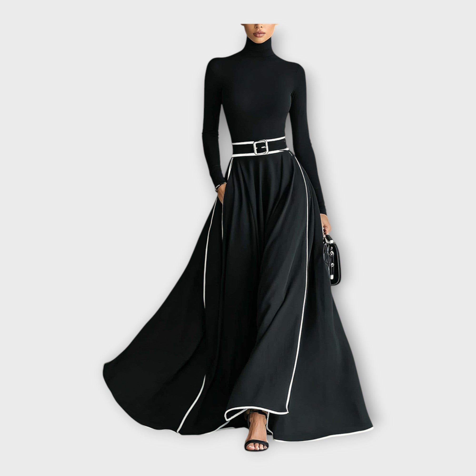 Black long-sleeve maxi dress with high neck, silver-buckle waist belt, flowing skirt