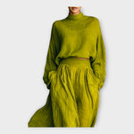 Green knit turtleneck top with high-waist pleated maxi skirt set