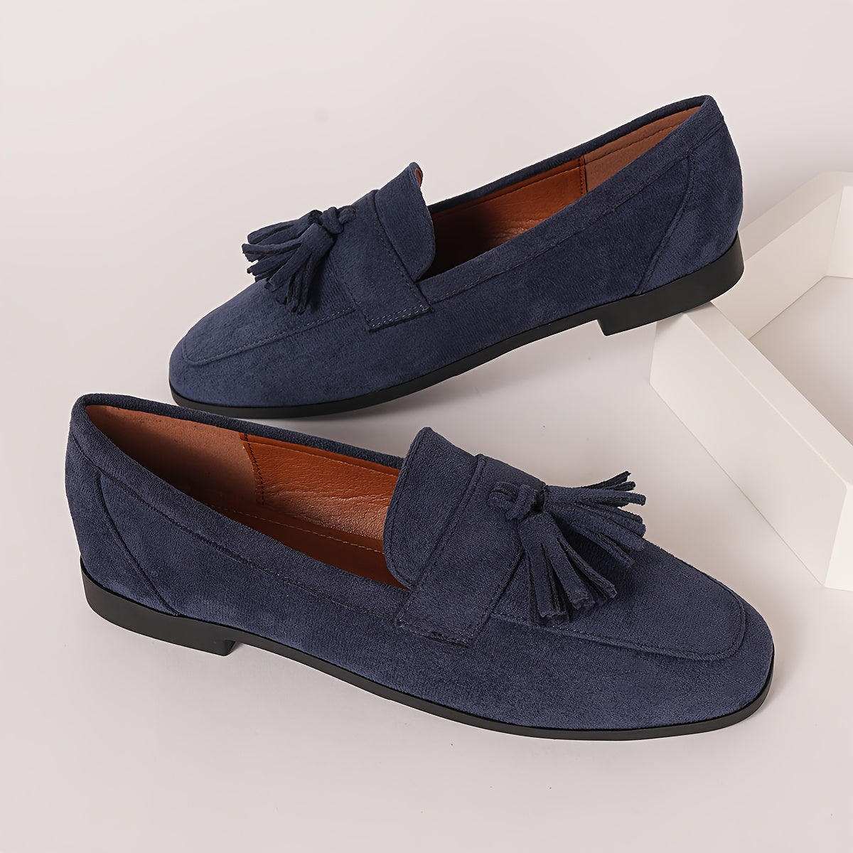 Navy suede tassel loafers, matching pair with slip-on vamp
