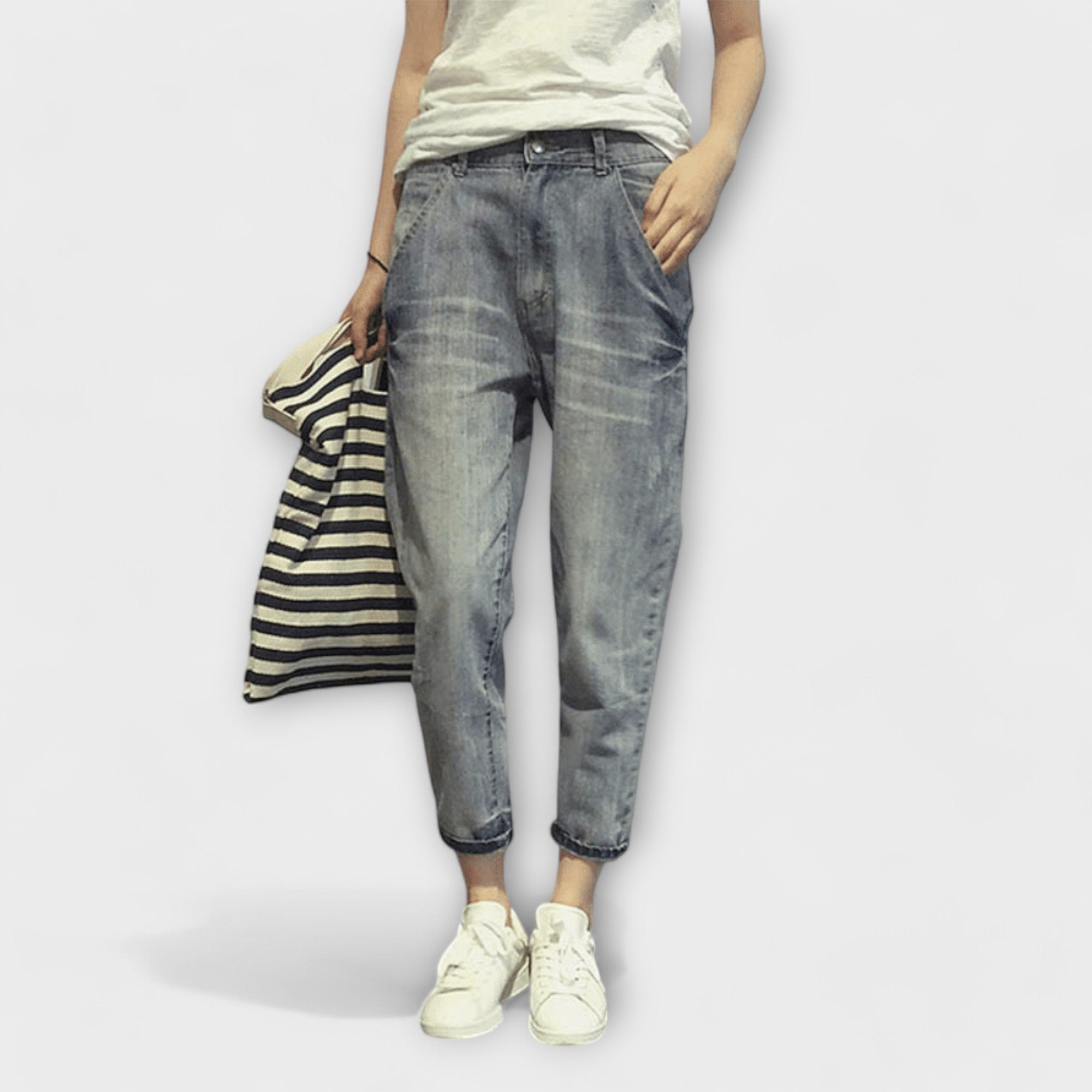 Washed gray cropped jeans with tapered legs and rolled cuffs