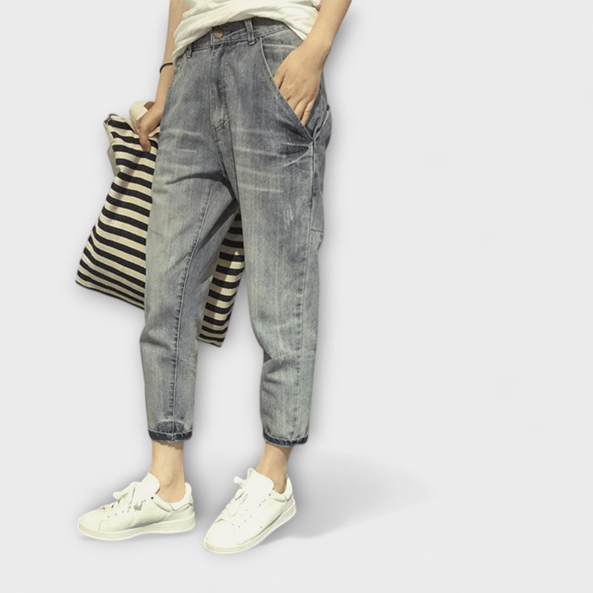 Gray washed jeans with tapered legs and cuffed hems