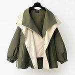 Two-tone parka jacket on hanger, olive green body with light cream draped front