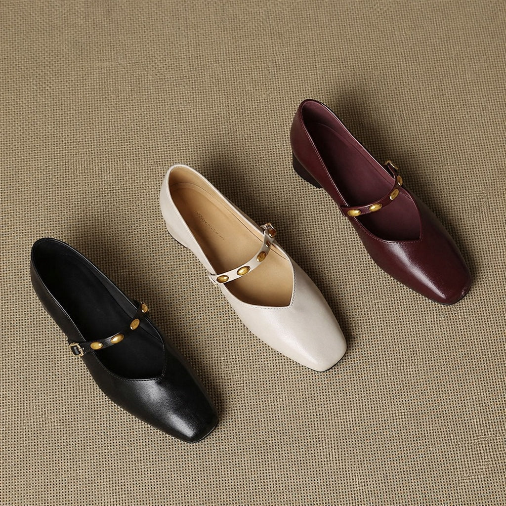 Leather ballet flats set in black, beige, and burgundy with gold buckles