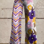 Boho wide-leg pants in purple, yellow, and pink abstract floral print