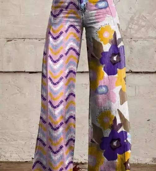 Boho wide-leg pants in purple, yellow, and pink abstract floral print