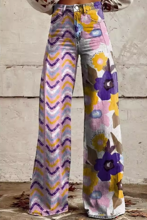 Boho wide-leg pants in purple, yellow, and pink abstract floral print