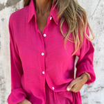 Casual button-up shirt and matching shorts set, fuchsia pink, open neckline detail