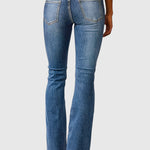 High-waisted slim-fit blue jeans, back view with patch pockets and belt loops