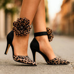 Leopard print pointed pumps with black ankle strap and large leopard flower rosette