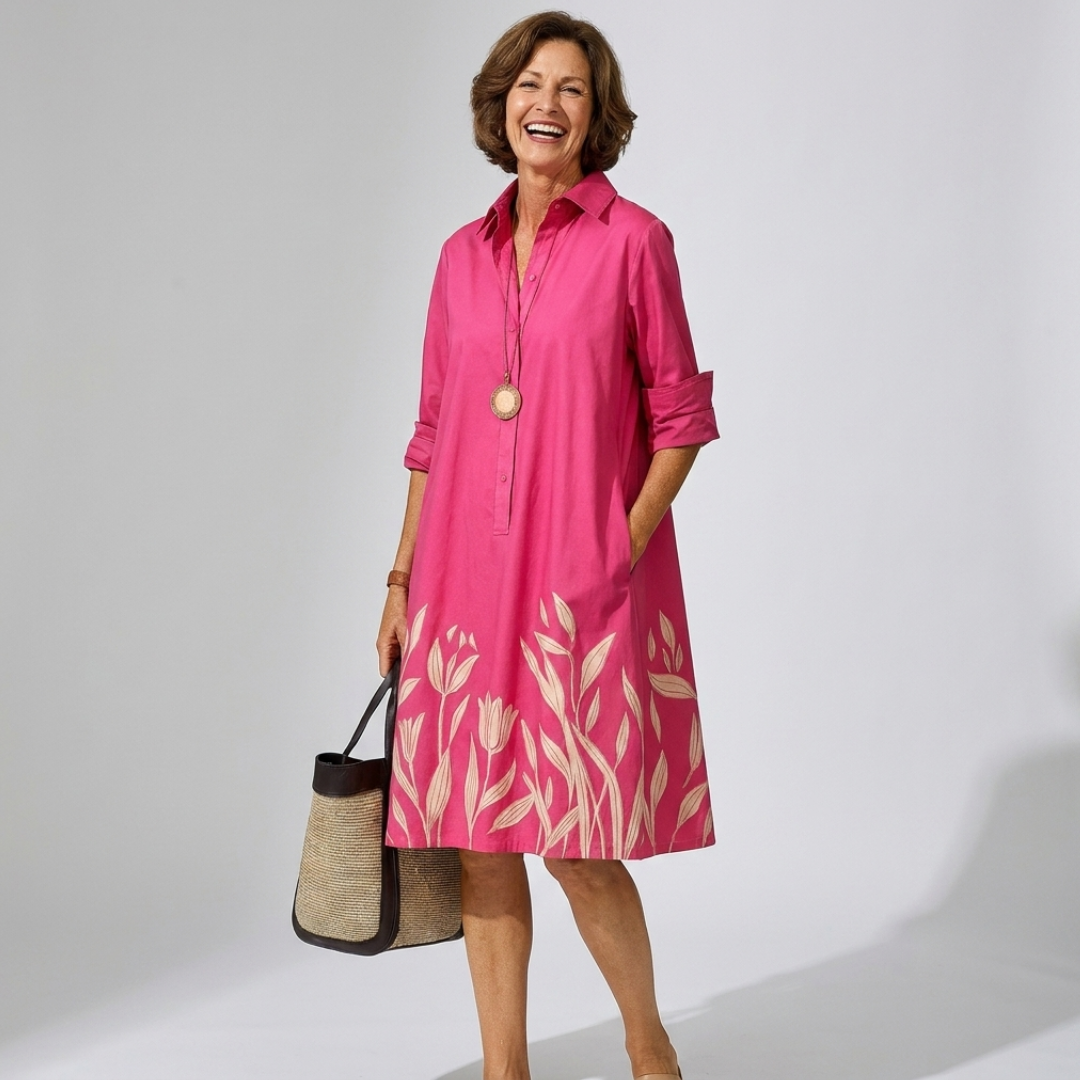 Daphne summer shirt dress in bright pink with rolled sleeves and leaf-print skirt