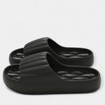 All-season slippers, black molded slip-on slides with textured footbed and wide strap