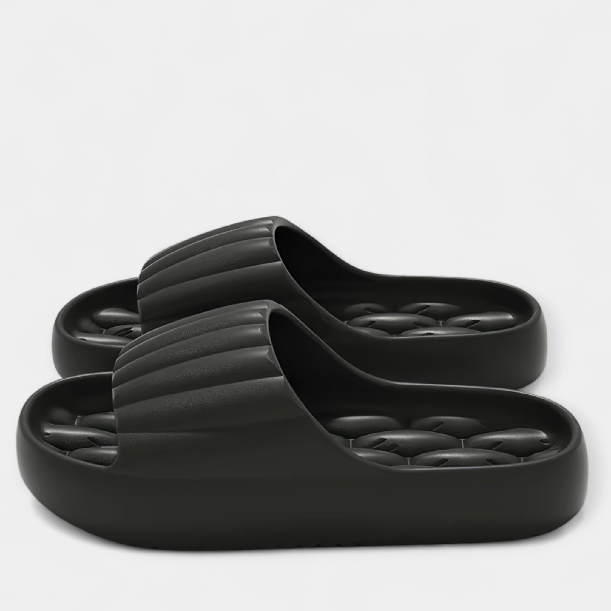 All-season slippers, black molded slip-on slides with textured footbed and wide strap