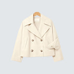 Destiny beige double-breasted coat, notch lapels, button front, flap pockets.