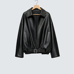 Black oversized zip-up jacket with pointed collar, front patch pockets, belted hem