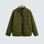 Arja olive green roomy quilted puffer jacket, full-zip front, side pockets.
