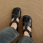 Black natural leather open-toe sandals with buckle ankle strap
