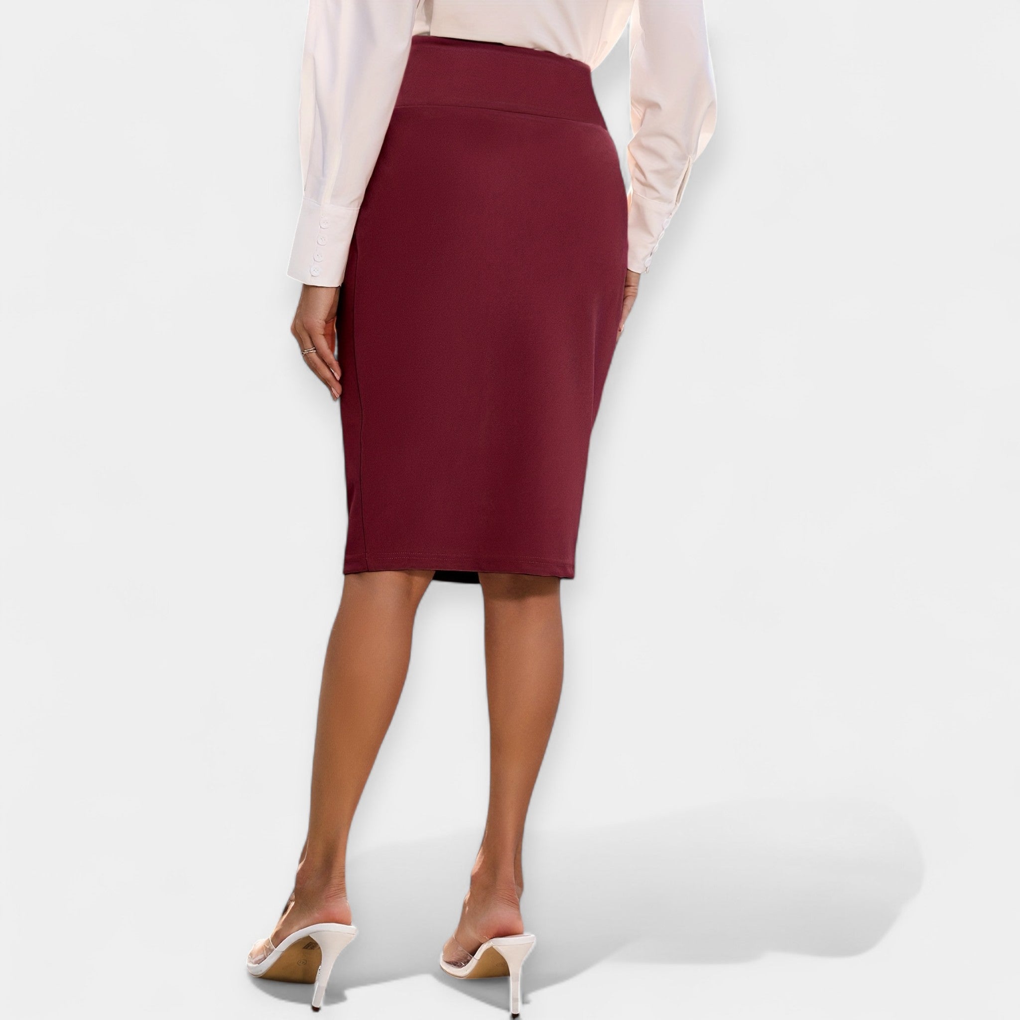 High-waist midi pencil skirt in deep red, close fit to mid-calf