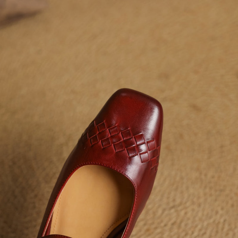 Red square-toe Mary Jane flat with woven panel detail on the vamp.