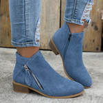 Blue suede ankle boots with side zipper and low block heel, orthopedic design.