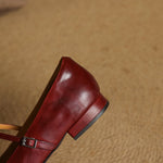 Red Mary Jane flat showing side profile with square toe and low block heel.