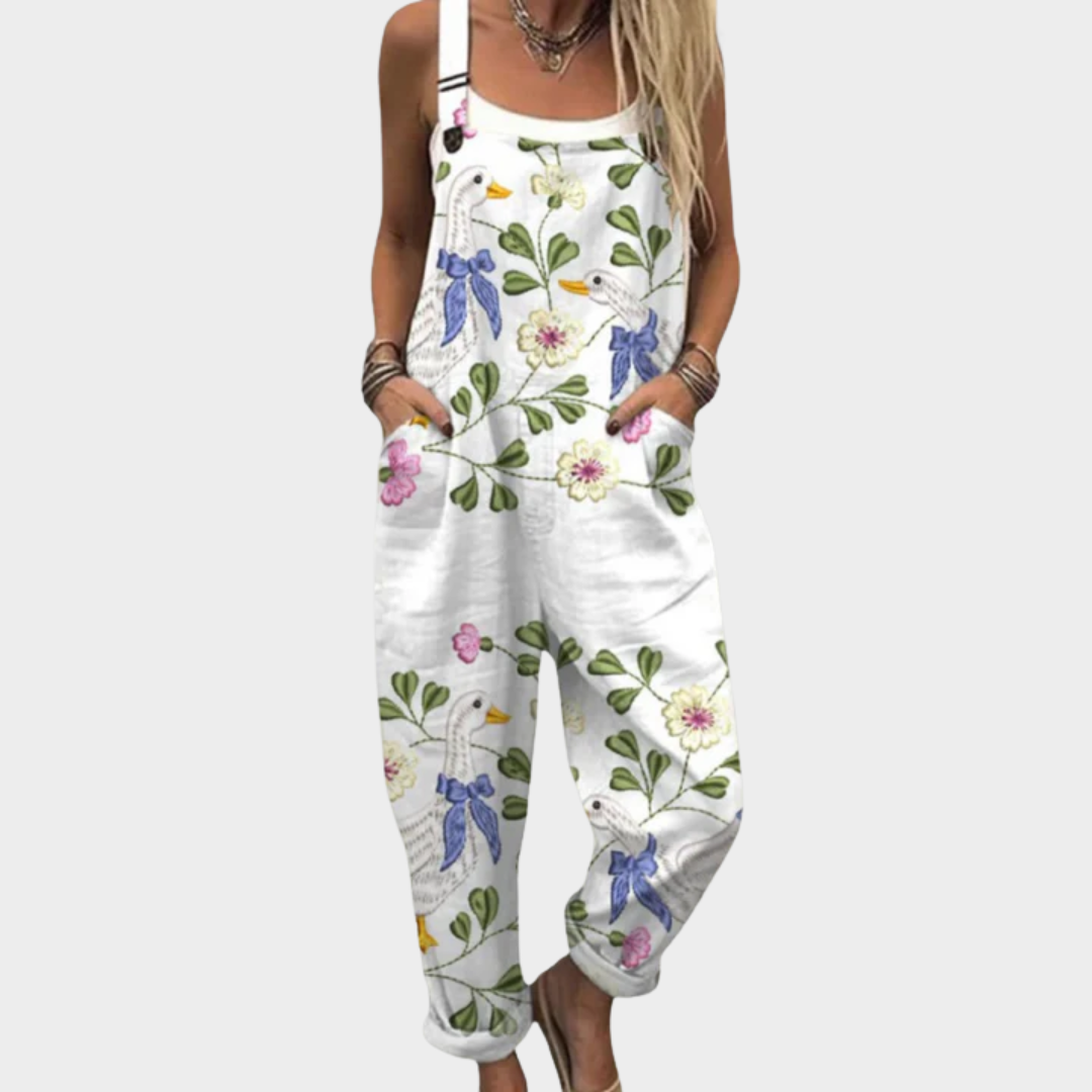 Loose-fit printed overalls, white sleeveless bib with floral bird pattern