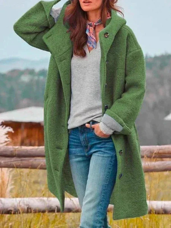 Long green hooded coat with button front and side pockets